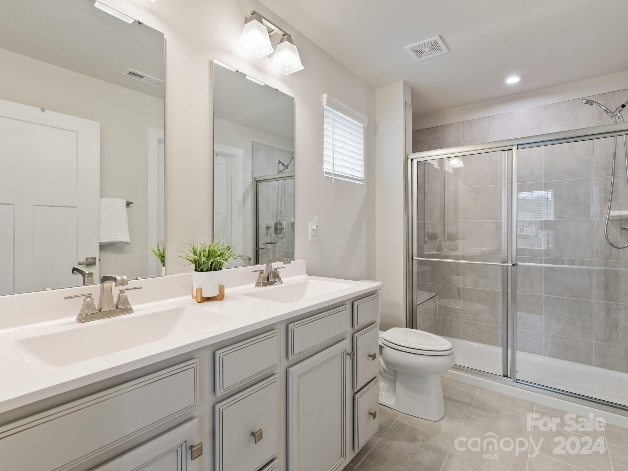 309 Damask Drive Lancaster, SC 29720 - Photo 16 of 28 a bathroom with a sink toilet and shower