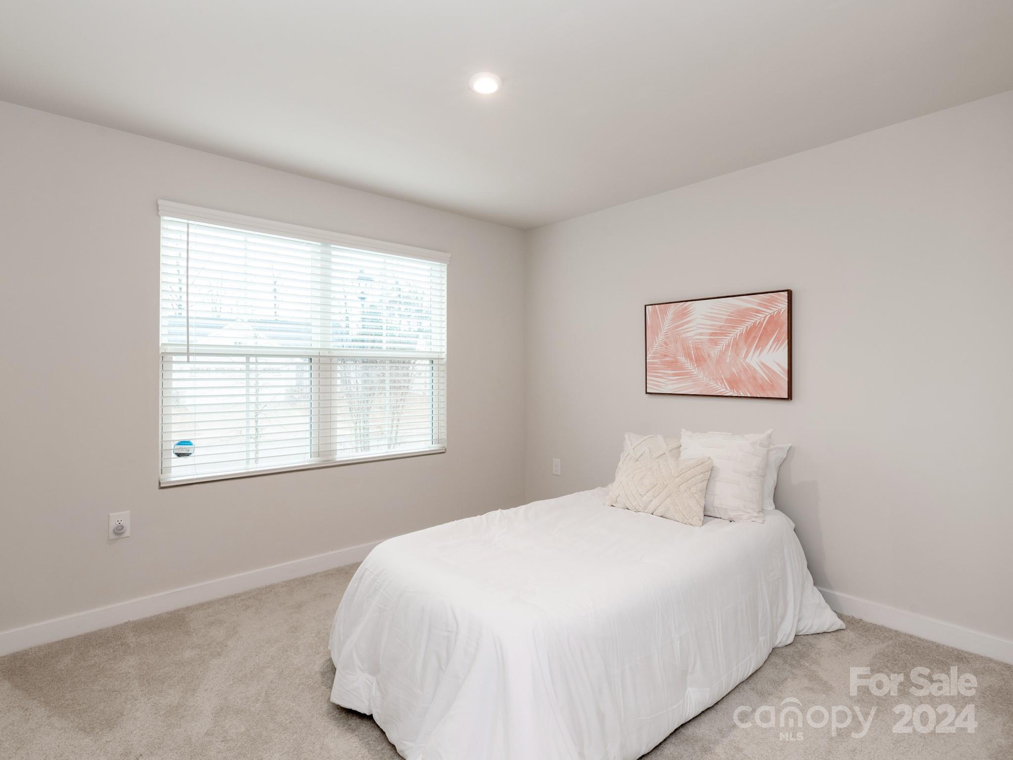 309 Damask Drive Lancaster, SC 29720 - Photo 20 of 28 a bedroom with a bed and a window