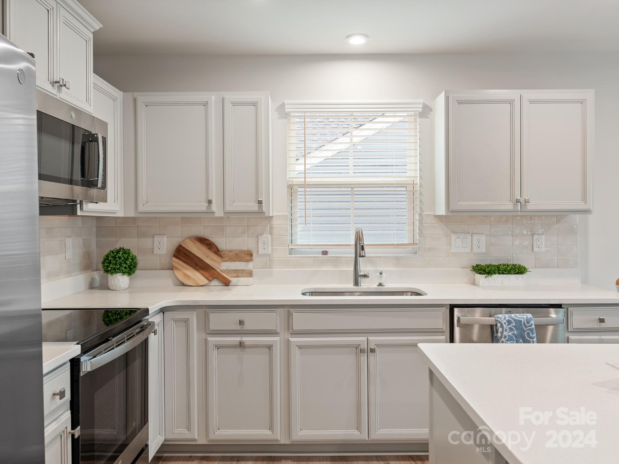 309 Damask Drive Lancaster, SC 29720 - Photo 2 of 28 a kitchen with a sink stove and cabinets