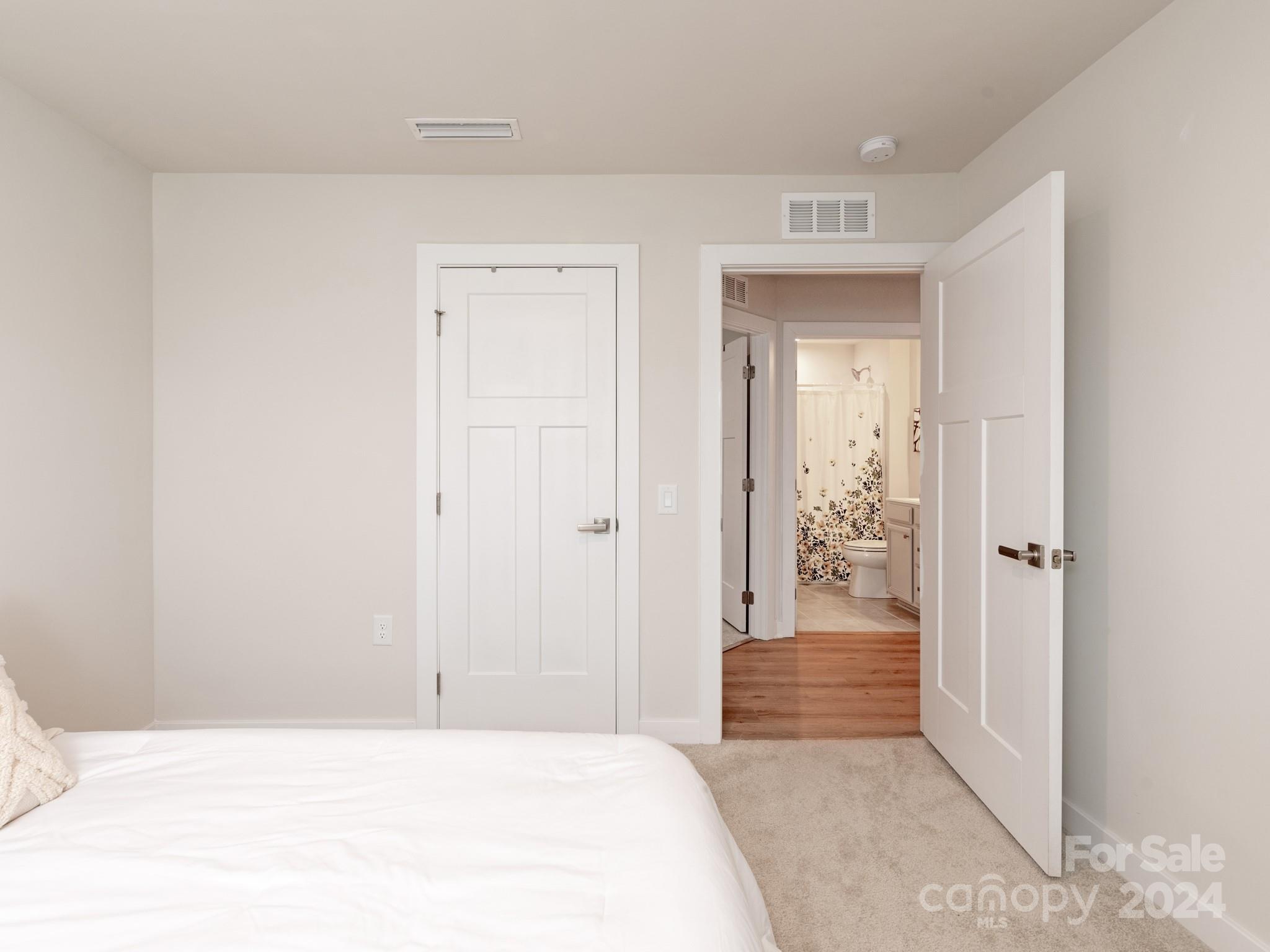 309 Damask Drive Lancaster, SC 29720 - Photo 21 of 28 a bedroom with a bed and a bathroom