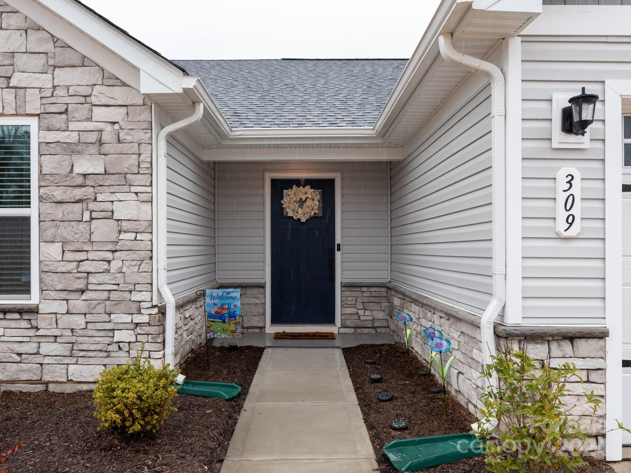 309 Damask Drive Lancaster, SC 29720 - Photo 24 of 28 a bunch of flowers in front of house