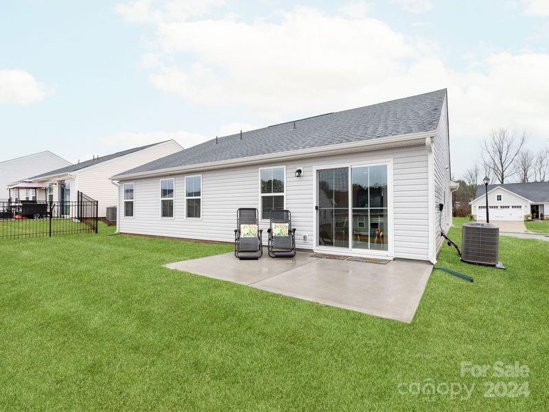 309 Damask Drive Lancaster, SC 29720 - Photo 26 of 28 a view of a house with a patio and a garden