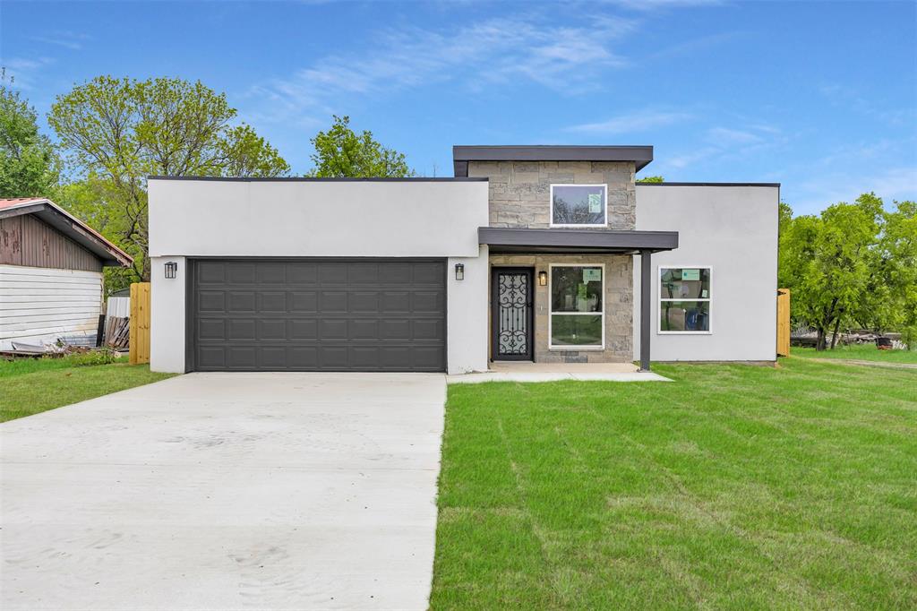 front view of a house with a garden