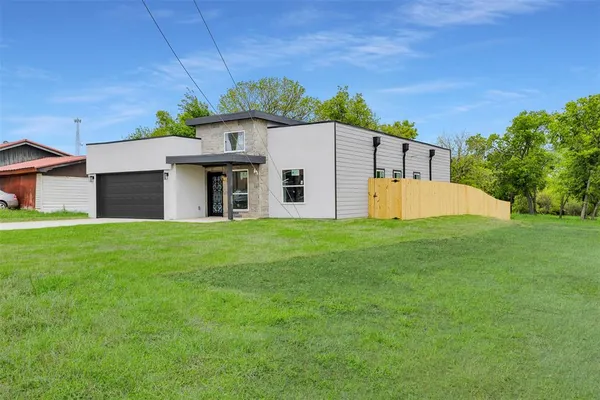 a front view of house with garden