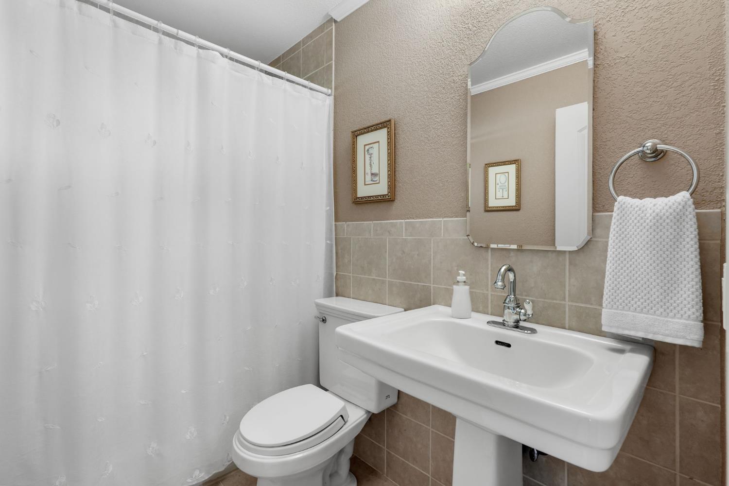 2276 El Cejo Circle Rancho Cordova, CA 95670 - Photo 22 of 41 The hall bath with a beautiful pedestal sink and tile shower over tub!