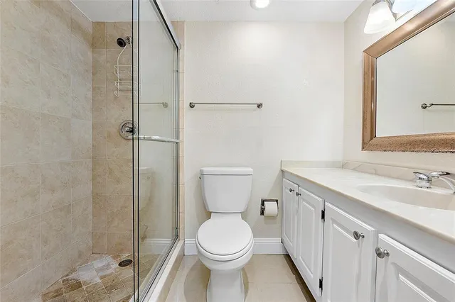 a bathroom with a toilet sink and a mirror