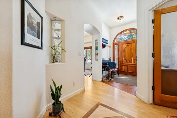 a view of a livingroom with furniture and a window