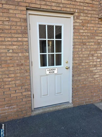 a view of an empty room with a door