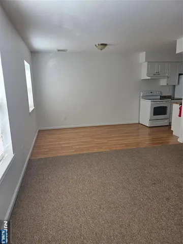 a view of a kitchen with microwave and cabinets