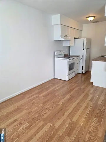 a view of kitchen with wooden floor