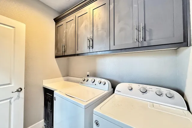 a bathroom with a toilet and a mirror