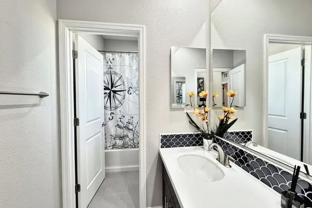a view of a kitchen from the hallway