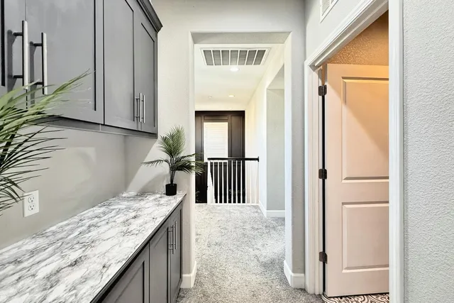 a view of a street with houses on both side