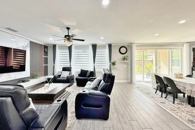 a large kitchen with a table and chairs