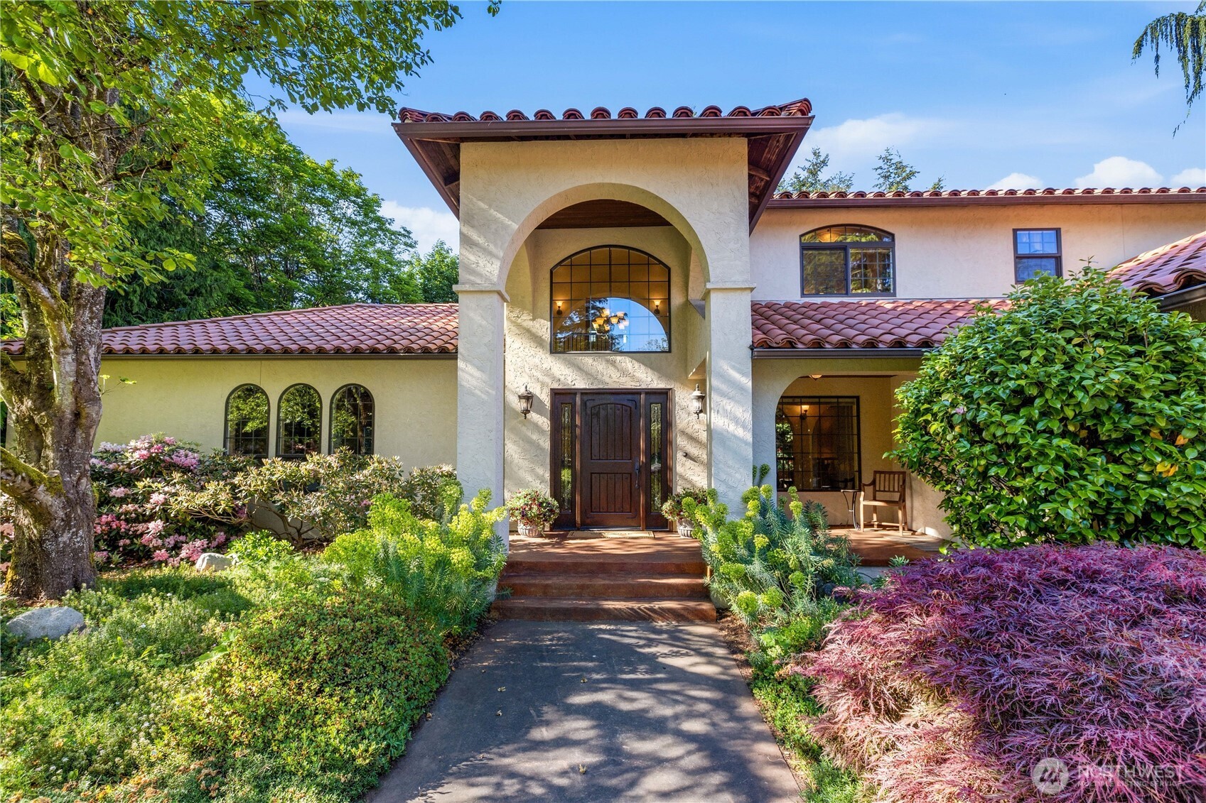 a front view of a house with garden