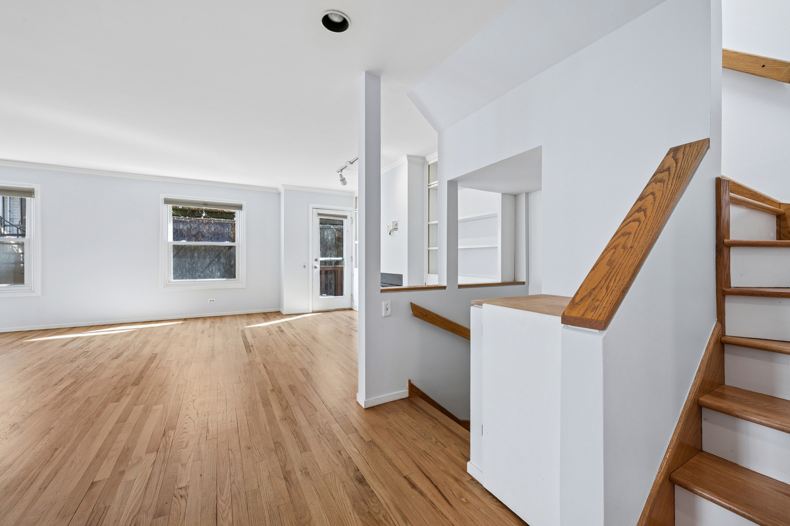 3239 North Kenmore Avenue, Unit 5 Chicago, IL 60657 - Photo 13 of 35 a view of an entryway with wooden floor and stairs