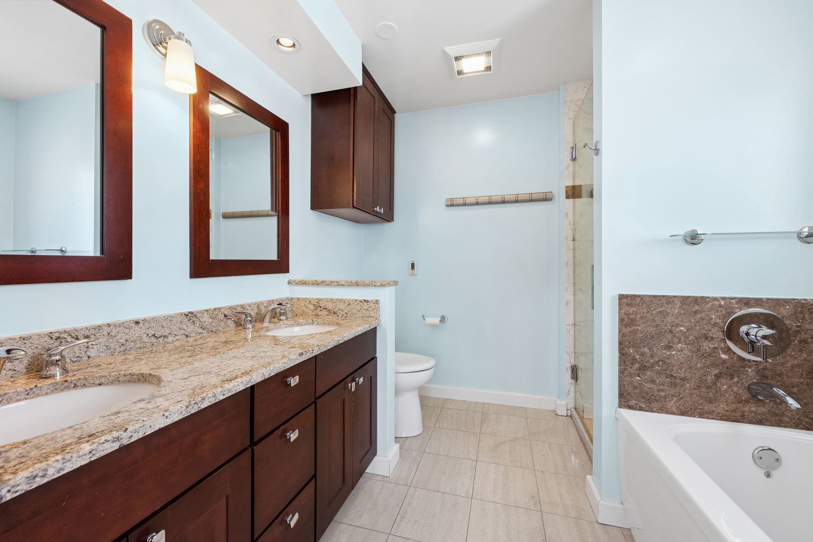 3239 North Kenmore Avenue, Unit 5 Chicago, IL 60657 - Photo 17 of 35 a bathroom with a sink a toilet and shower