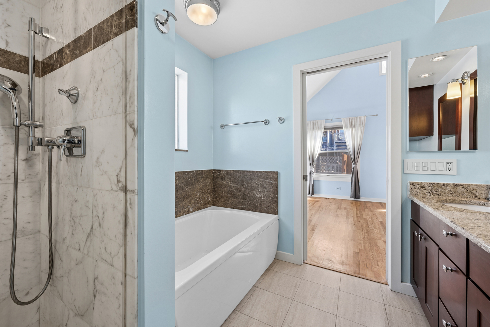 3239 North Kenmore Avenue, Unit 5 Chicago, IL 60657 - Photo 18 of 35 a bathroom with a bathtub and a shower