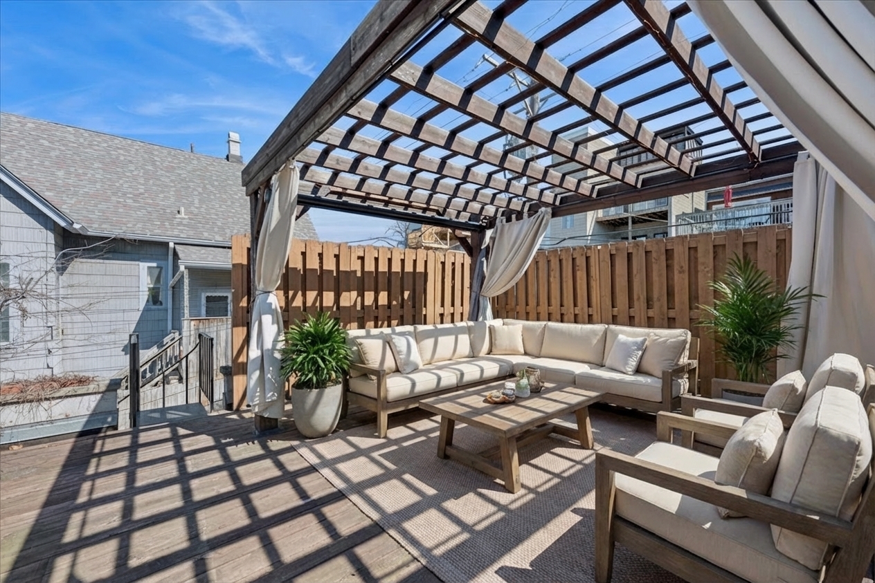 3239 North Kenmore Avenue, Unit 5 Chicago, IL 60657 - Photo 32 of 35 a view of a patio with glass top table and chairs