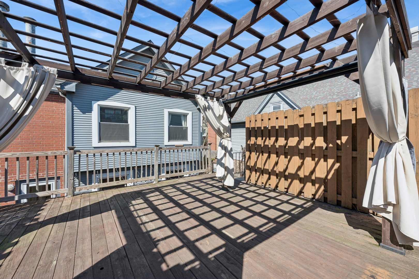 3239 North Kenmore Avenue, Unit 5 Chicago, IL 60657 - Photo 34 of 35 a view of a balcony with wooden floor