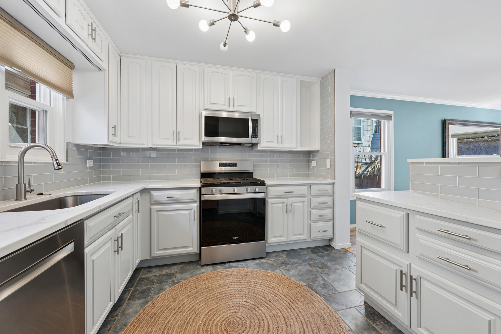 3239 North Kenmore Avenue, Unit 5 Chicago, IL 60657 - Photo 6 of 35 a kitchen with cabinets stainless steel appliances and a sink