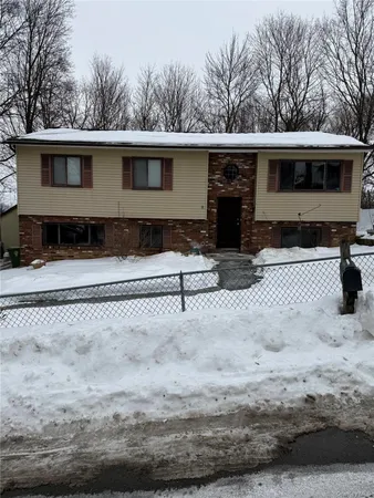 a view of a house with a snow in the yard