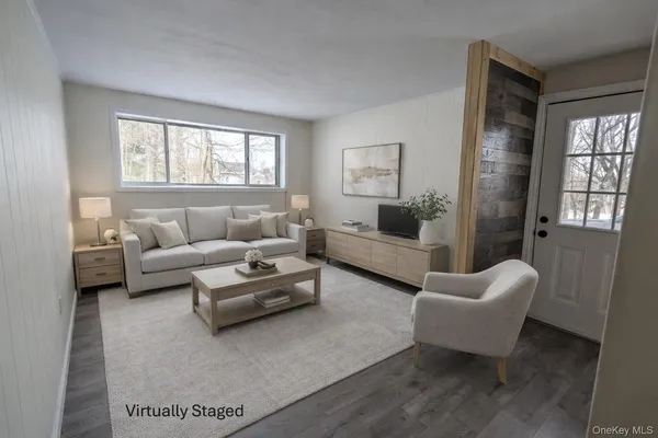 a living room with furniture and window