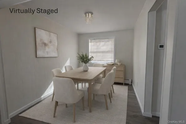a view of a dining room with furniture and window