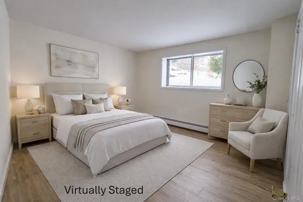 a bedroom with a bed and window