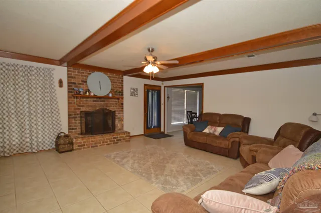 a kitchen with granite countertop a sink cabinets and appliances
