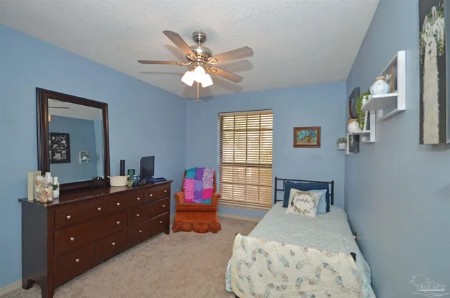 a bathroom with a toilet and shower