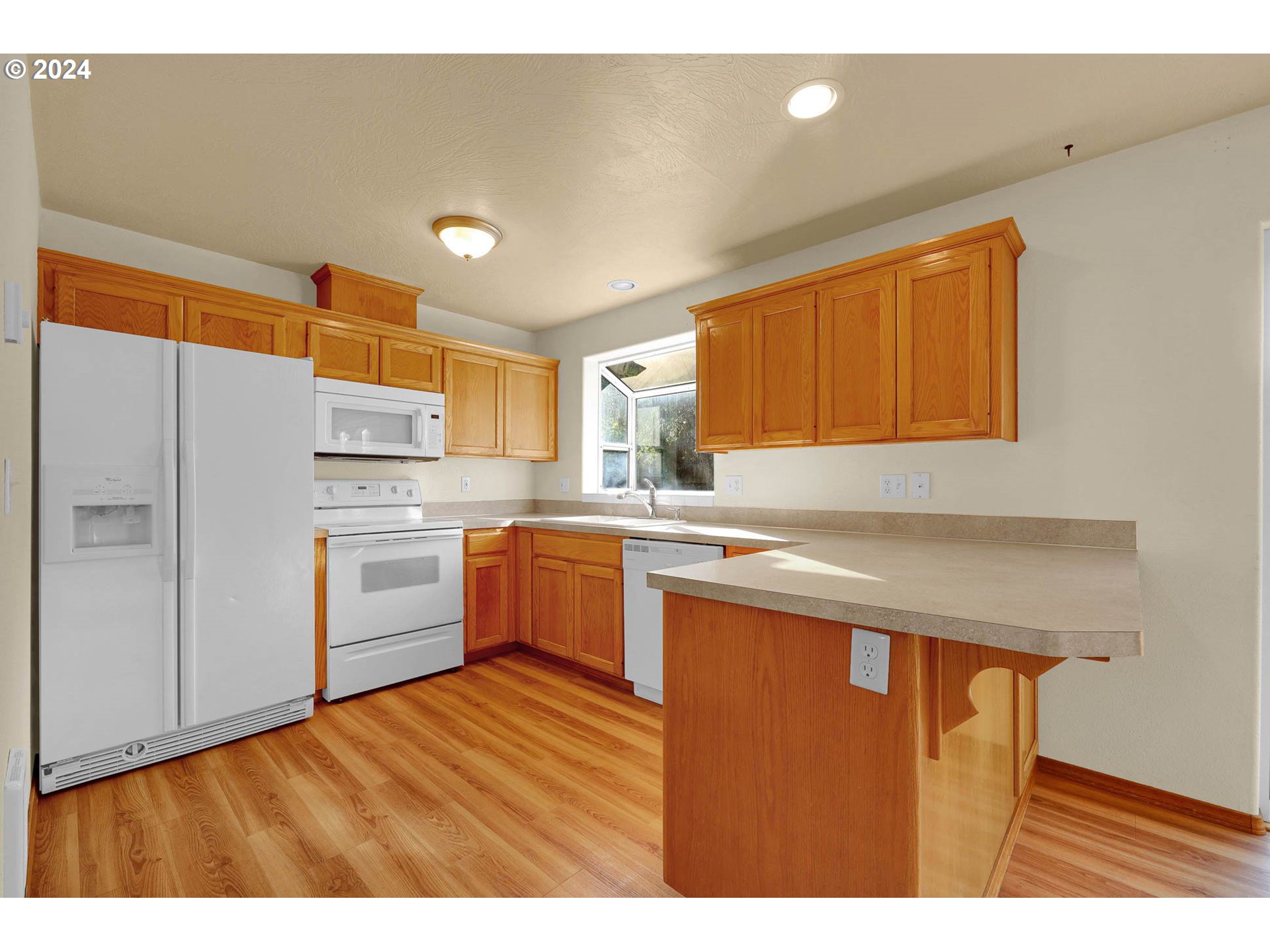 537 Nicholas Drive Springfield, OR 97477 - Photo 13 of 37 a kitchen with a refrigerator sink and cabinets