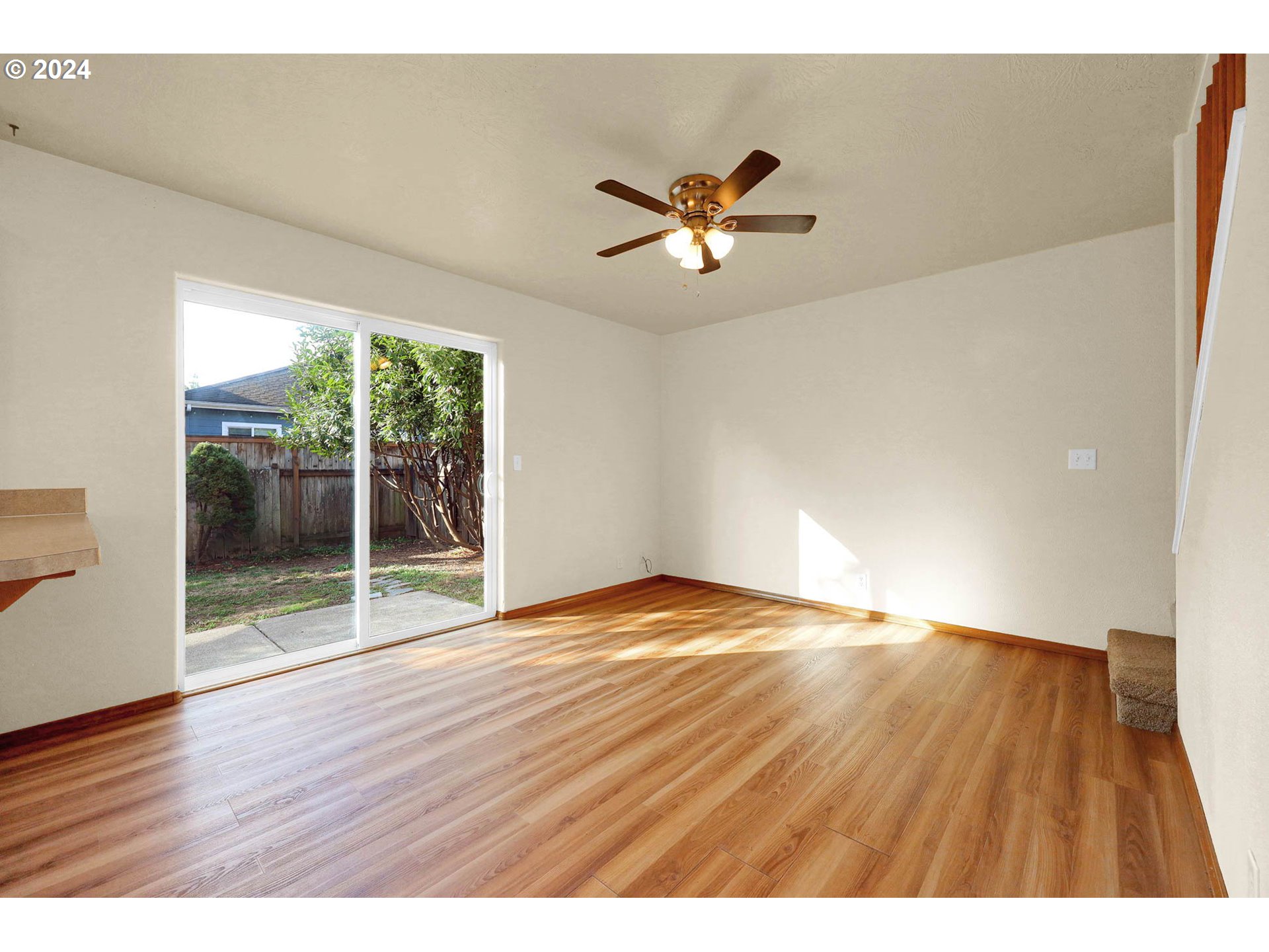 537 Nicholas Drive Springfield, OR 97477 - Photo 17 of 37 a view of empty room with wooden floor and fan