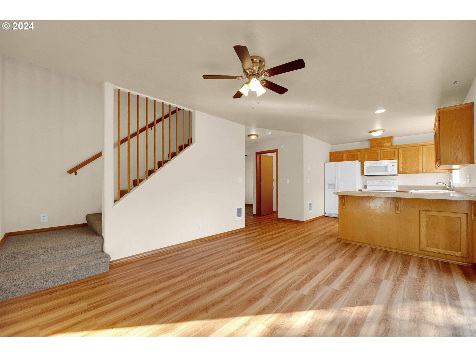 537 Nicholas Drive Springfield, OR 97477 - Photo 19 of 37 a view of a kitchen with wooden floor and electronic appliances