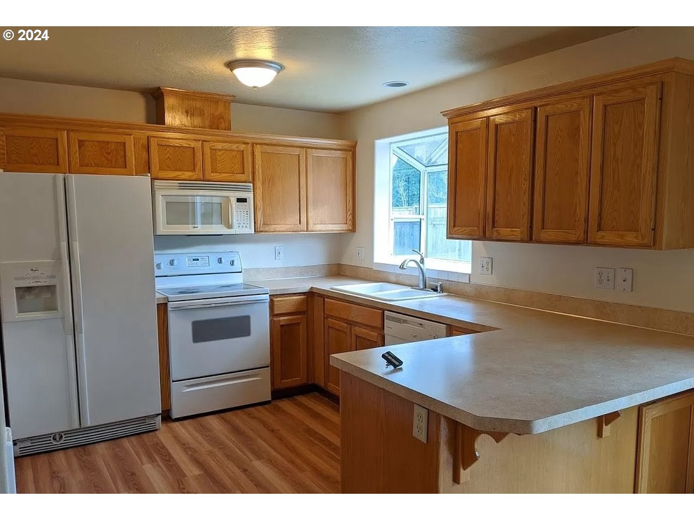 537 Nicholas Drive Springfield, OR 97477 - Photo 2 of 37 a kitchen that has a sink a stove and cabinets