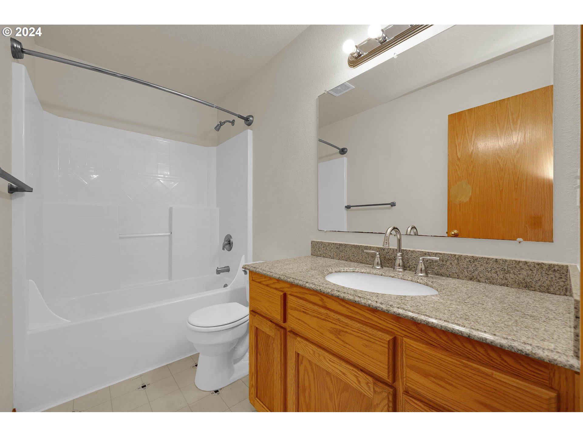 537 Nicholas Drive Springfield, OR 97477 - Photo 26 of 37 a bathroom with a granite countertop sink a toilet and shower