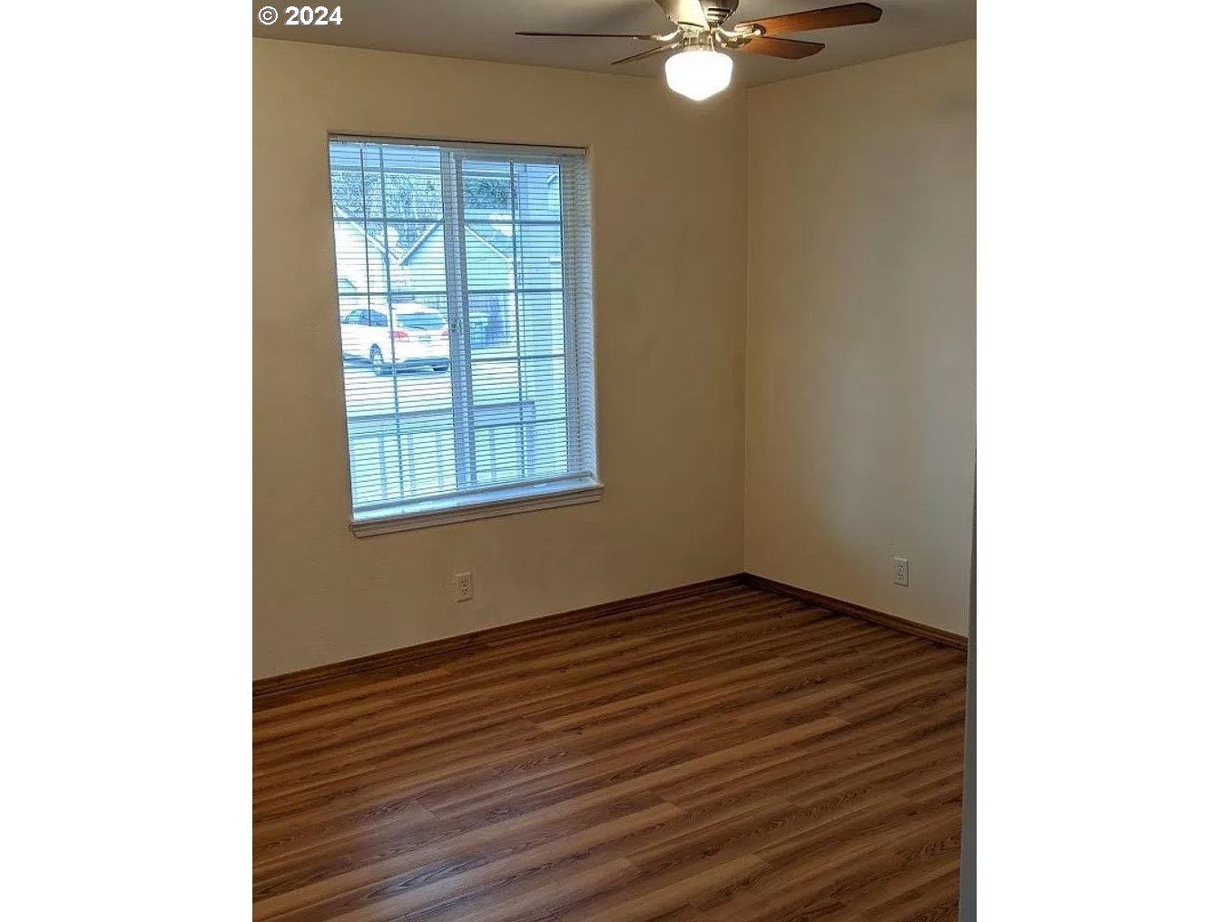 537 Nicholas Drive Springfield, OR 97477 - Photo 10 of 37 a view of an empty room with wooden floor and a window