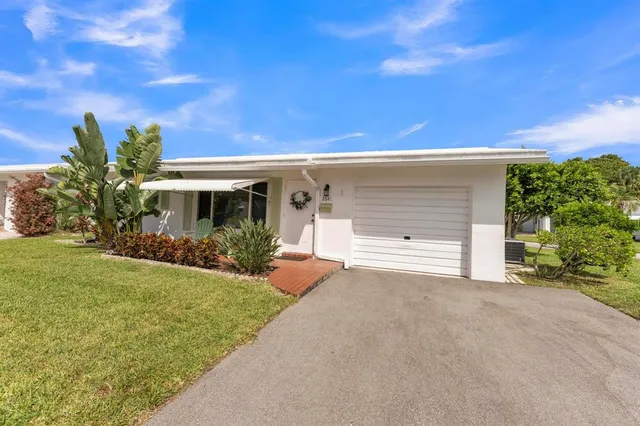 a bathroom with a sink a mirror and vanity