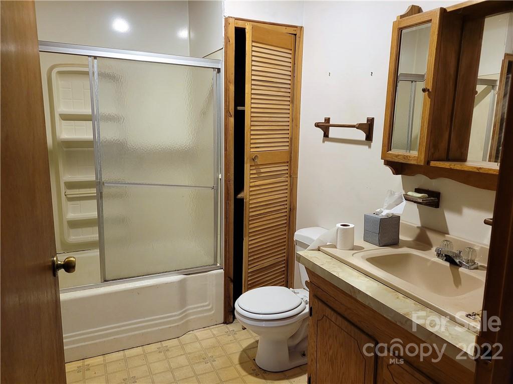 941 Engineer Road Bostic, NC 28018 - Photo 15 of 29 a bathroom with a sink toilet and shower