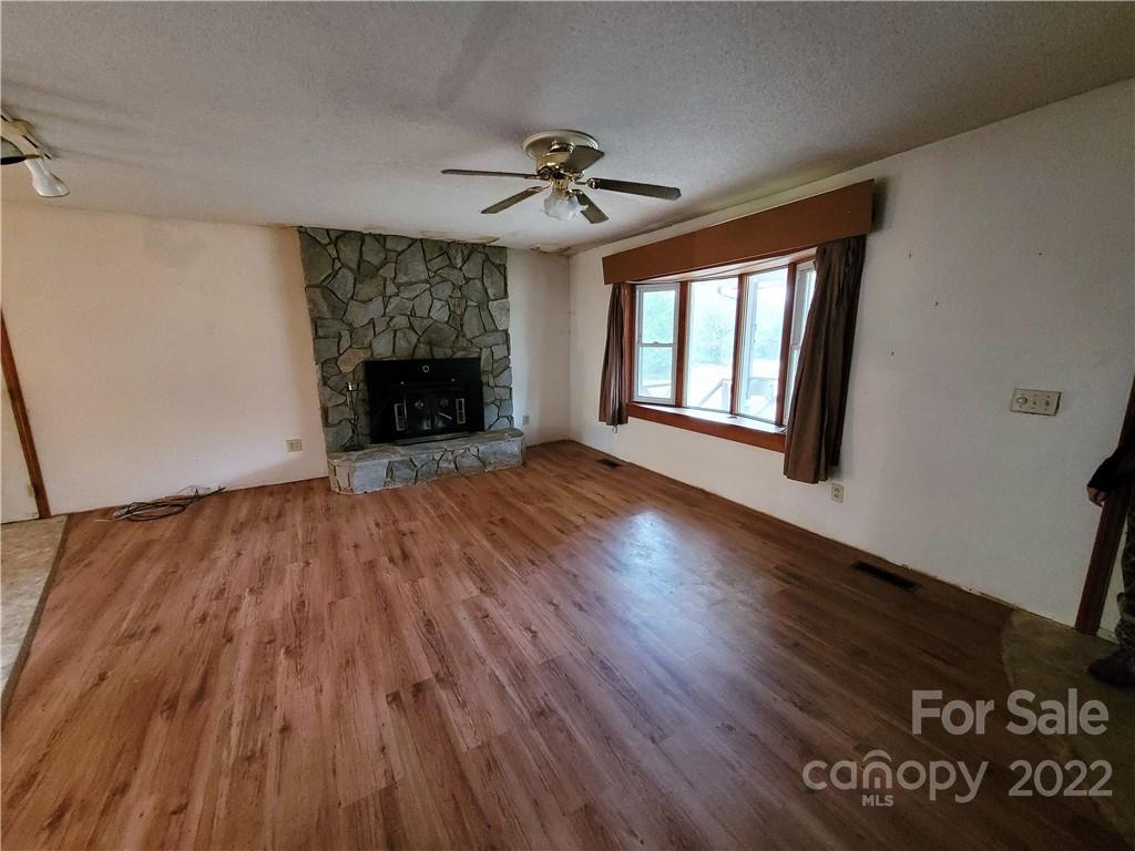 941 Engineer Road Bostic, NC 28018 - Photo 3 of 29 wooden floor in an empty room with a window