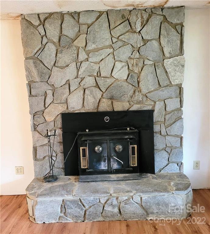 941 Engineer Road Bostic, NC 28018 - Photo 5 of 29 a view of a fireplace with wooden floor