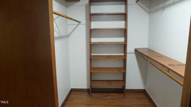 a white toilet sitting next to a shower