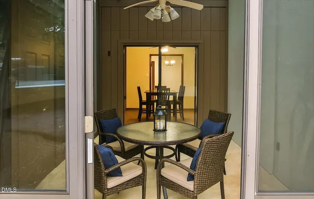 a view of a dining room with furniture and window