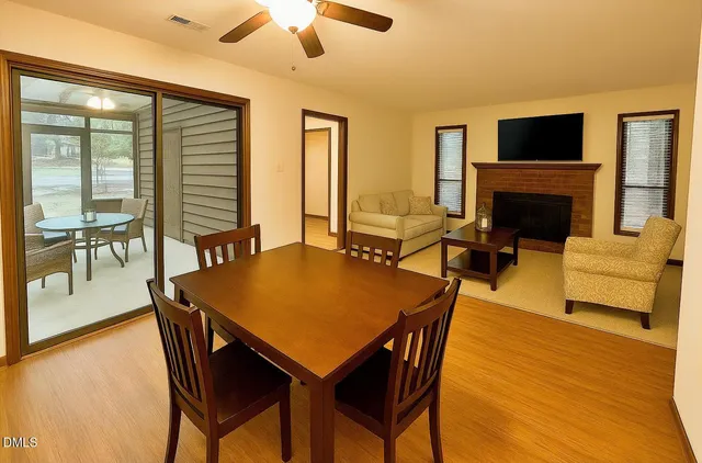 a view of a dining room with furniture window and wooden floor