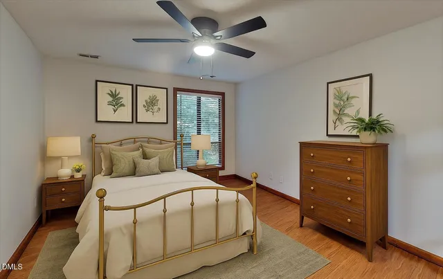 a bedroom with a bed and a dresser