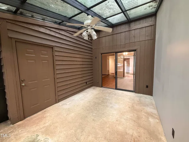 a view of a livingroom with a dishwasher and a window