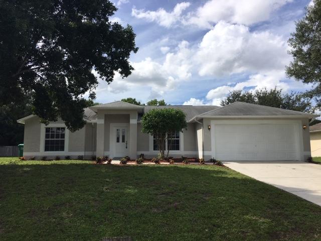 831 Southwest Harvard Road Port St. Lucie, FL 34953 - Photo 1 of 17 front