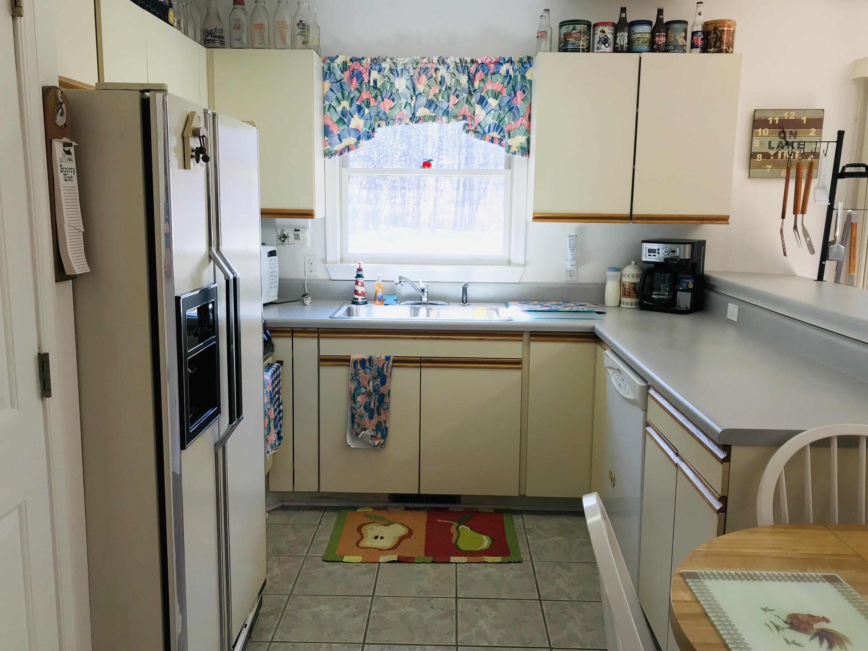 214 Highland Lake Road Union Hall, VA 24176 - Photo 11 of 33 a kitchen with a refrigerator and a sink