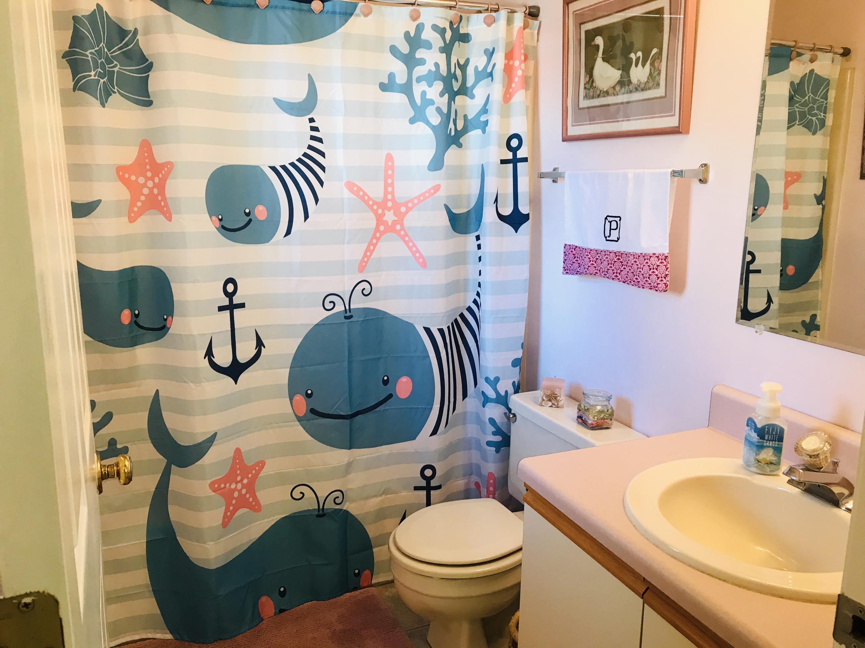 214 Highland Lake Road Union Hall, VA 24176 - Photo 13 of 33 a bathroom with a sink and mirror with toilet