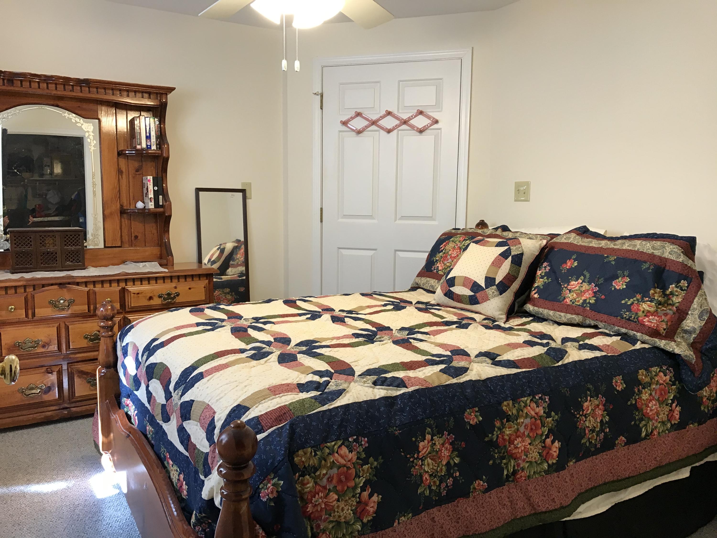 214 Highland Lake Road Union Hall, VA 24176 - Photo 14 of 33 a bedroom with a bed and dresser
